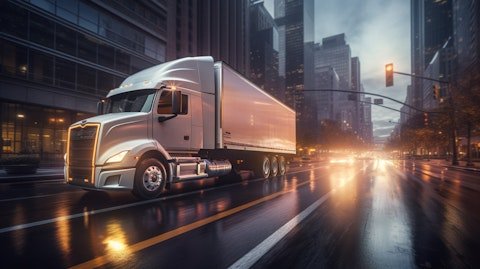 A view inside an energy delivery truck driving through a busy city street.