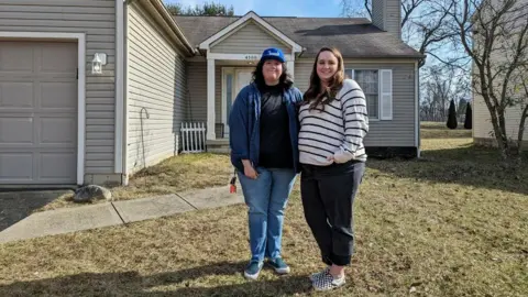 Getty Images Megan Holter and her wife Sonia outside their new home in Columbus