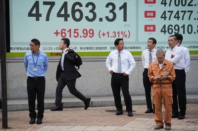 Asian shares mostly higher after Wall St ends an erratic day with gains